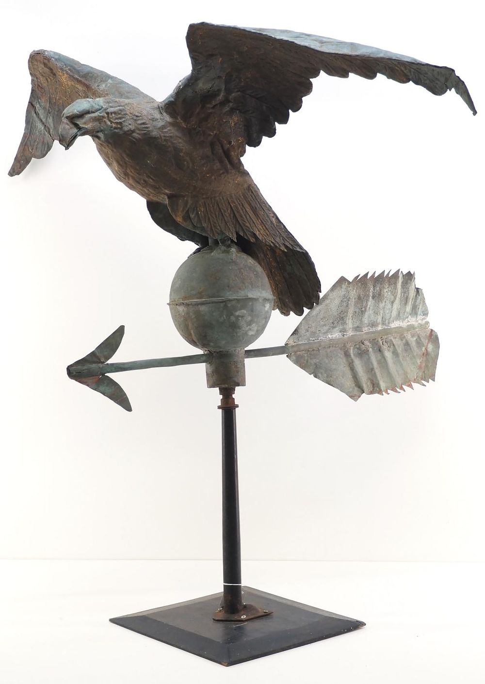 Lot 746: Early metal full-bodied eagle weathervane on ball