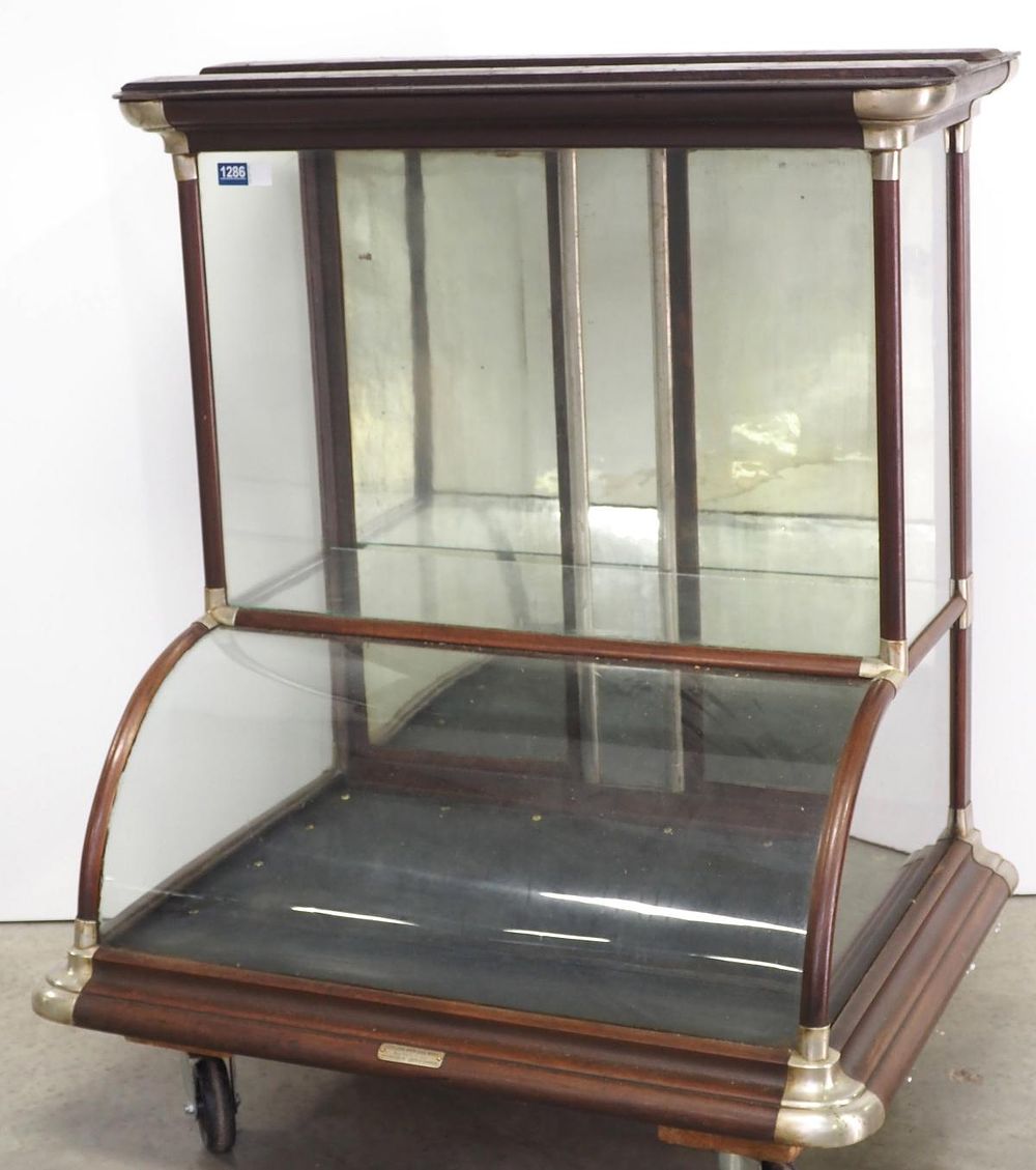 Lot 1286: Wood and nickel curved glass countertop showcase