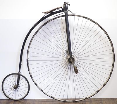 19th Century American Rudge high-wheel bike with leather seat, front wheel 52"dia, rear wheel 