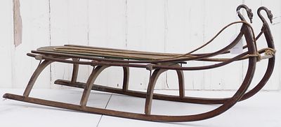 Wooden child's sled with metal runners decorated with birds, 40"L