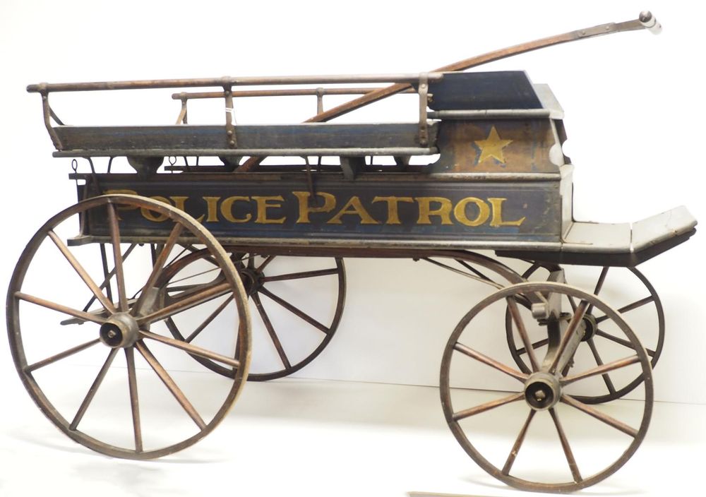 Lot 787: Police Patrol wooden child's pull-type wagon WOW!