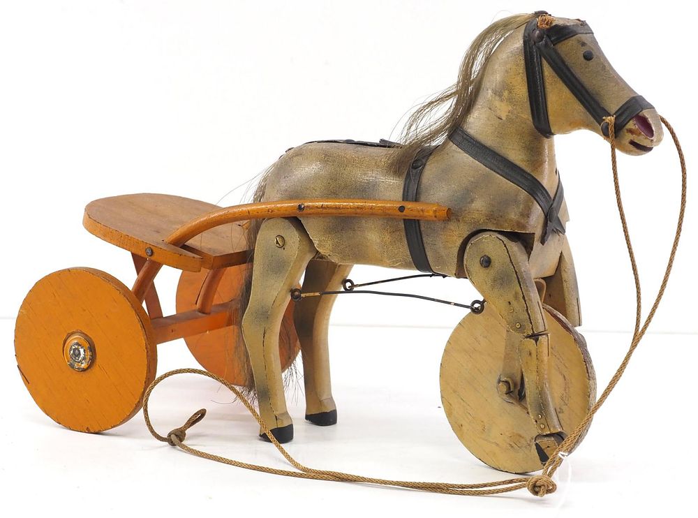 Lot 165: Early wooden horse & sulky toy