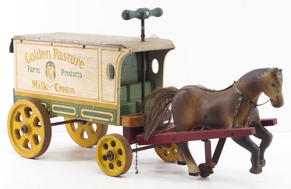 Lot 166: Early sit & ride milk delivery wagon