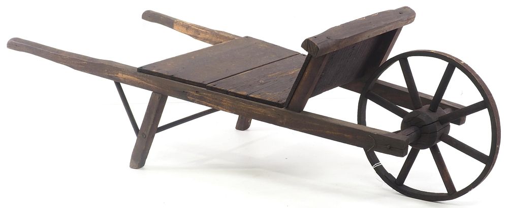 Lot 225: Early wooden child-size wheelbarrow
