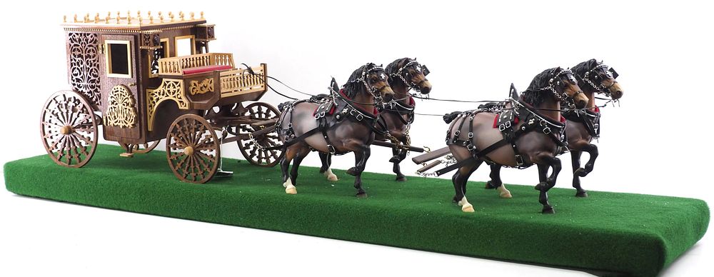 Lot 251: 4-horse hitch of Breyer horses with fancy coach