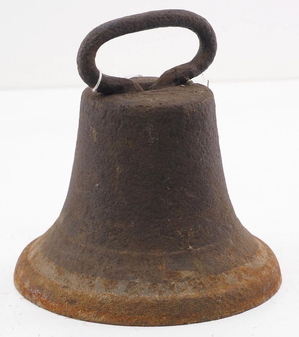 Lot 601: Cast iron bell-shaped horse tie