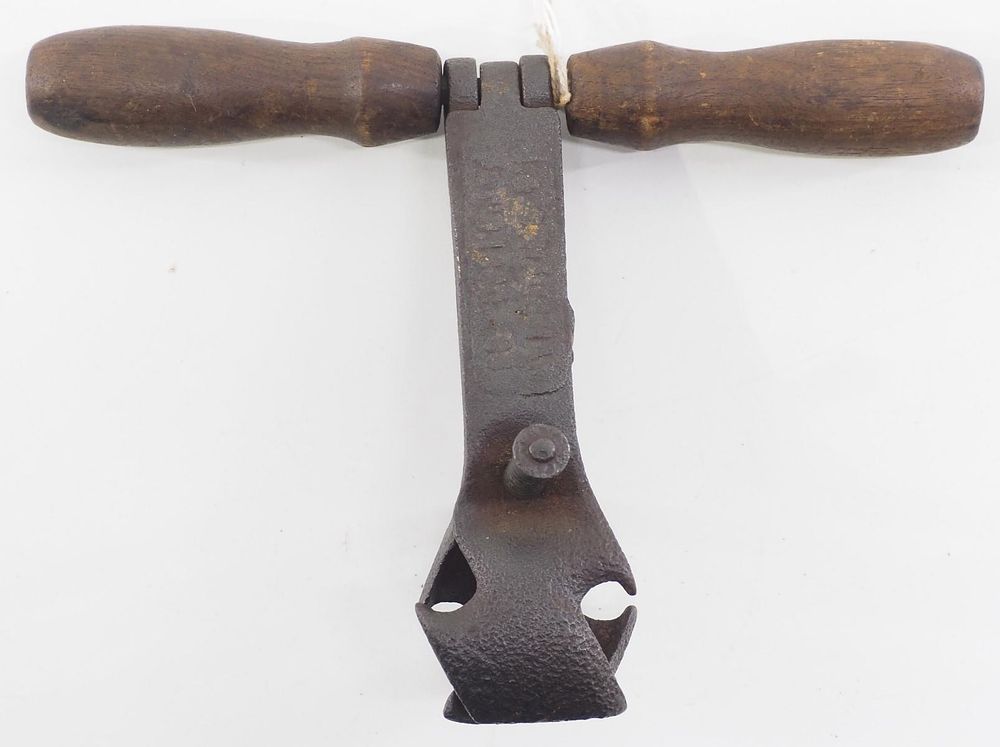 Lot 604: Early embossed T-handle hand corn sheller