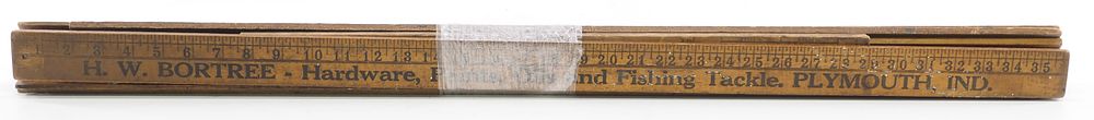 Lot 606: Bundle of early wooden advertising yardsticks