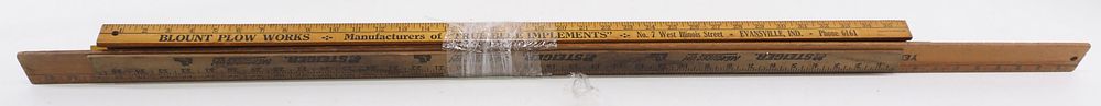 Lot 607: Bundle of early wooden advertising yardsticks