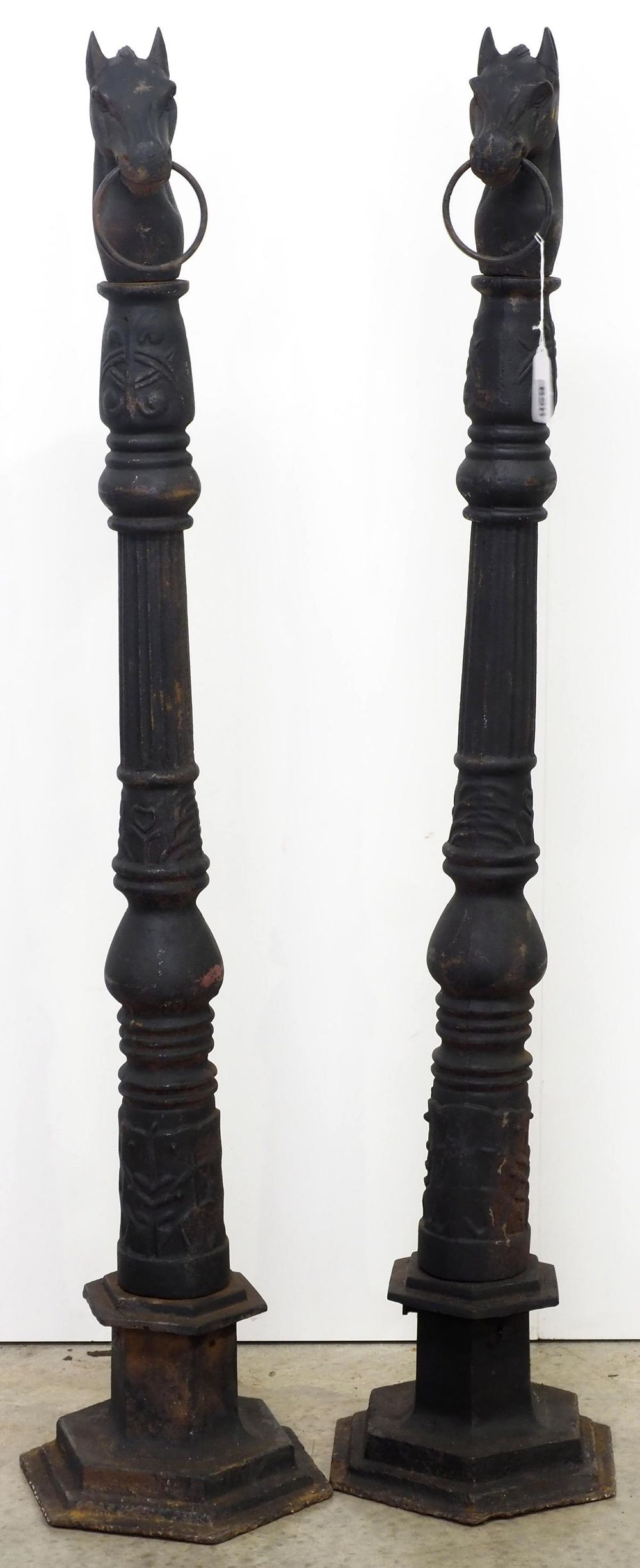 Lot 620: Pair of cast iron horse head hitching posts