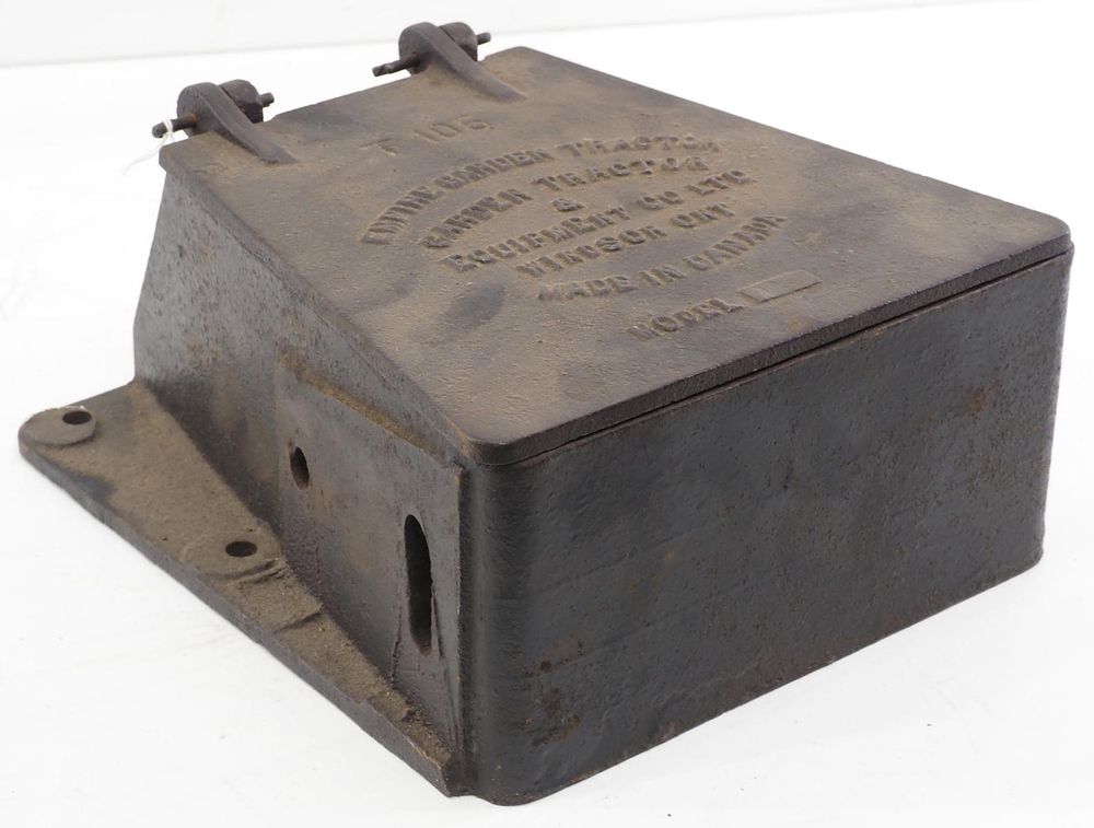 Lot 636: Empire Garden Tractor cast iron tool box