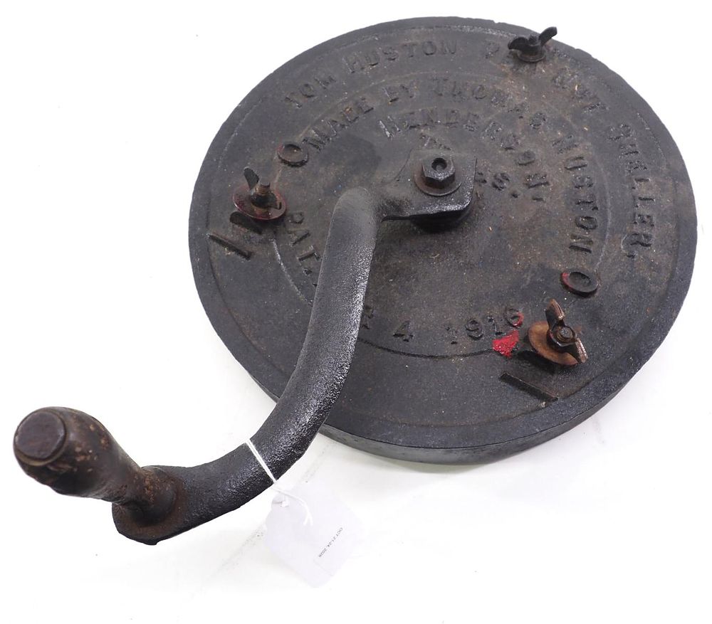 Lot 674: Tom Huston hand-crank cast iron peanut sheller
