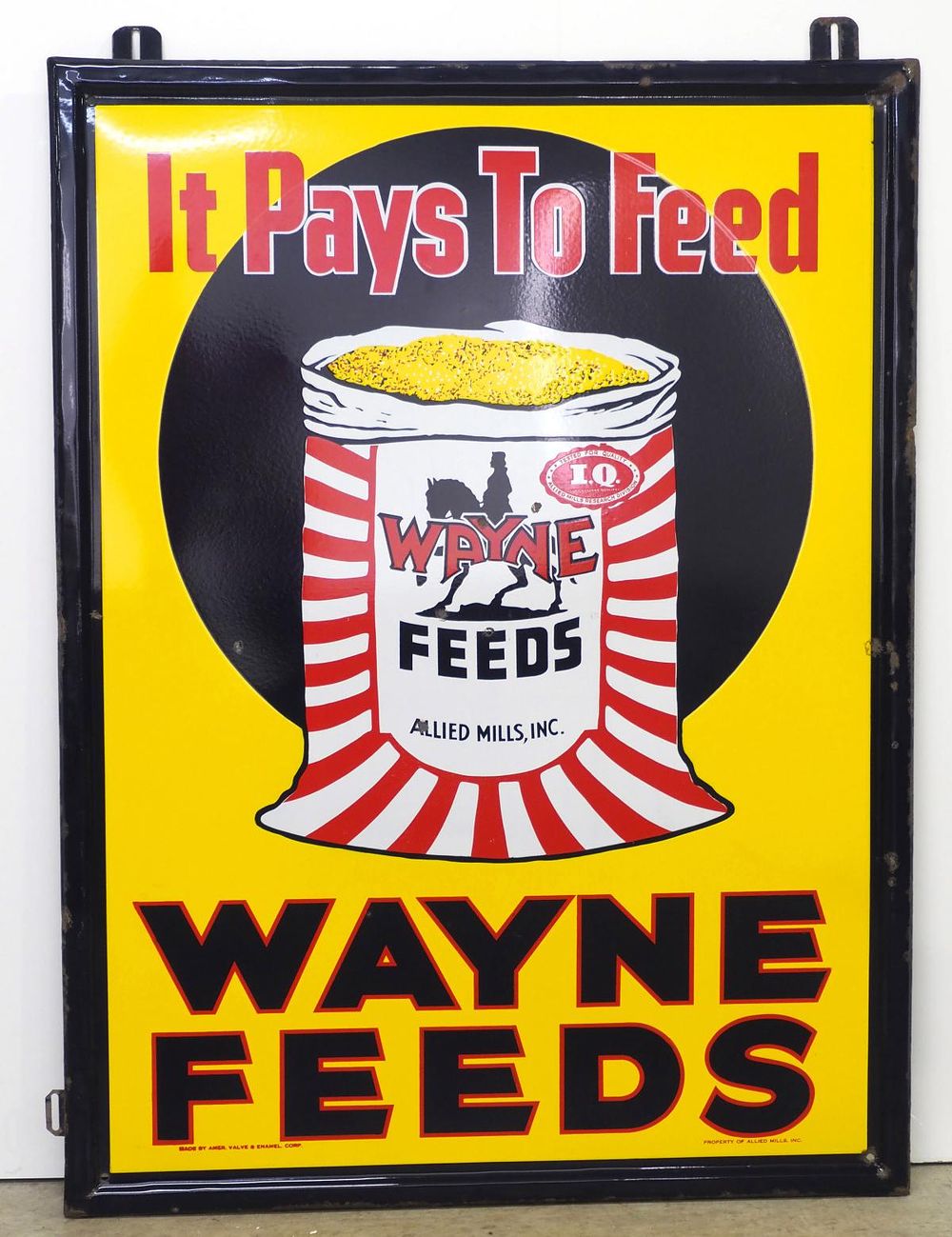Lot 781: Wayne Feeds "It Pays To Feed" sign