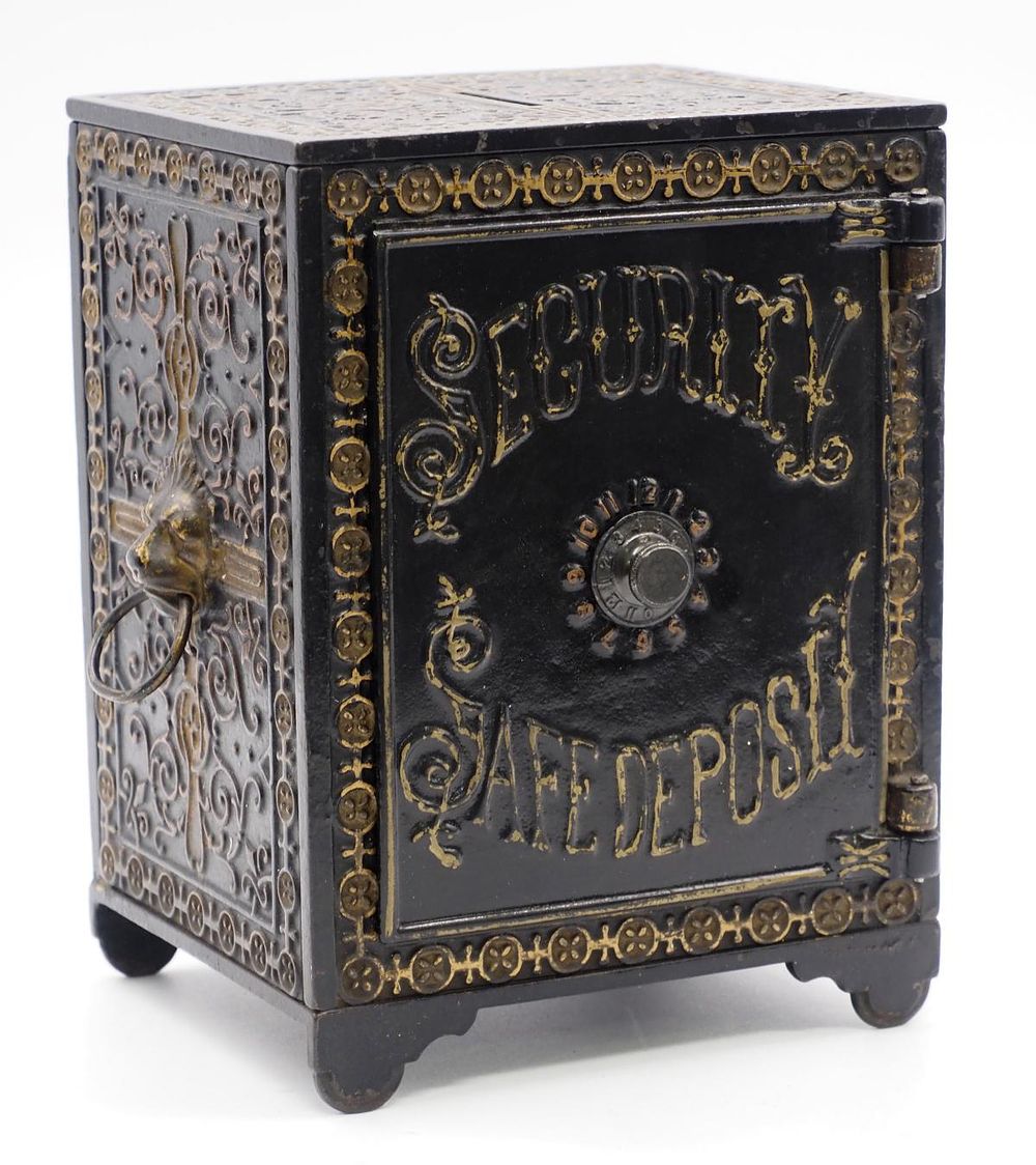 Lot 1046: "Security Safe Deposit" cast iron bank