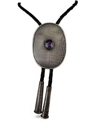 Sterling Silver Amethyst Bolo Tie. Marked "Ster, " tips and bolo test as sterling. Bolo 