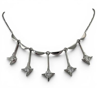 Mid Century 14K White Gold Diamond Star Necklace, 6.4g. Marked "14K." Length approximately 