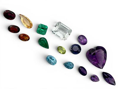 Grouping Of Unmounted Gemstones. Includes Emeralds, Ruby, Amethyst, Golden Topaz, Blue Topaz 