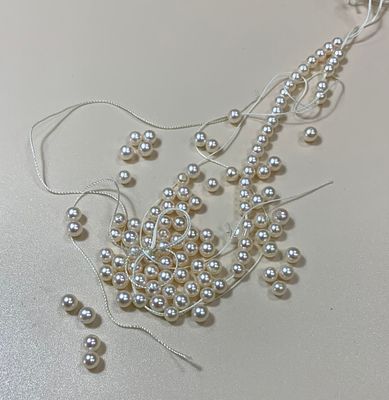 פנינים עגולות 3 מ׳׳מ קוטר בצבע לבן עם ברק ורדרד