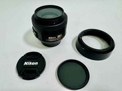 עדשת NIKON ניקון Nikkor 35mm F/1.8G AF-S DX F-Mount עם פילטר nikkor uv 52mm ופילטר החשכה nikkor 