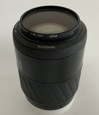 עדשת MINOLTA מינולטה יפני AF zoom 50mm f\3.5-4.8 zoom 70-210 mm פילטר UV Olympus מצב כללי טוב 