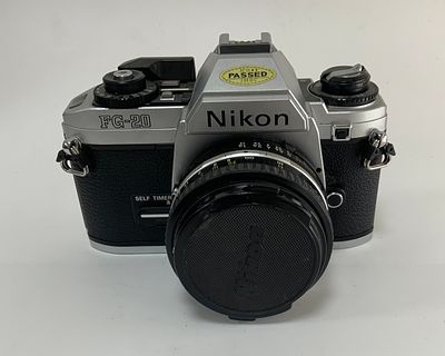 מצלמה עם עדשה NIKON ניקון f/1ץ9 3208764 FG-20. יפני NIKON SERIES E 50mm מצב משומש טוב מאוד