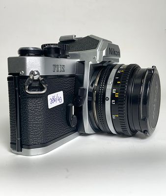 מצלמה עם עדשה FM2 N7842406 NIKON ניקון FG-20 50mm f/1.8. יפני מצב משומש טוב מאוד