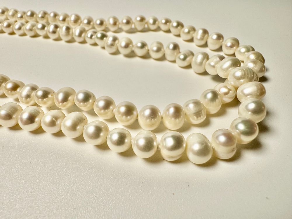 מחרוזת פנינים טובליות מתורבתות מבריכות גידול 150 ס''מ אורך - 1.5 מטר - לבנות יפות 7.5ס6 מ''מ - 