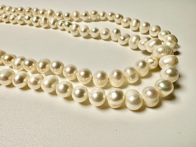 מחרוזת פנינים טובליות מתורבתות מבריכות גידול 150 ס''מ אורך - 1.5 מטר - לבנות יפות 7.5ס6 מ''מ - 