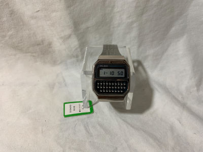 שעון מחשבון ALBA מתכת עם מדבקה ותגית מקורית 35X45 מ''מ - מצב עובד עם סוללה חדשה