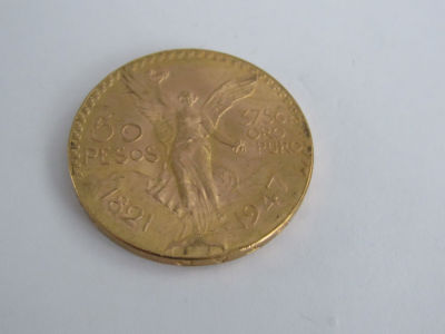 מטבע זהב 50 PESOS מקסיקו -37.5 גרם זהב טהור -37 מ"מ קוטר-משקל המטבע 41.7 גרם 
( אין דיוק במידות 