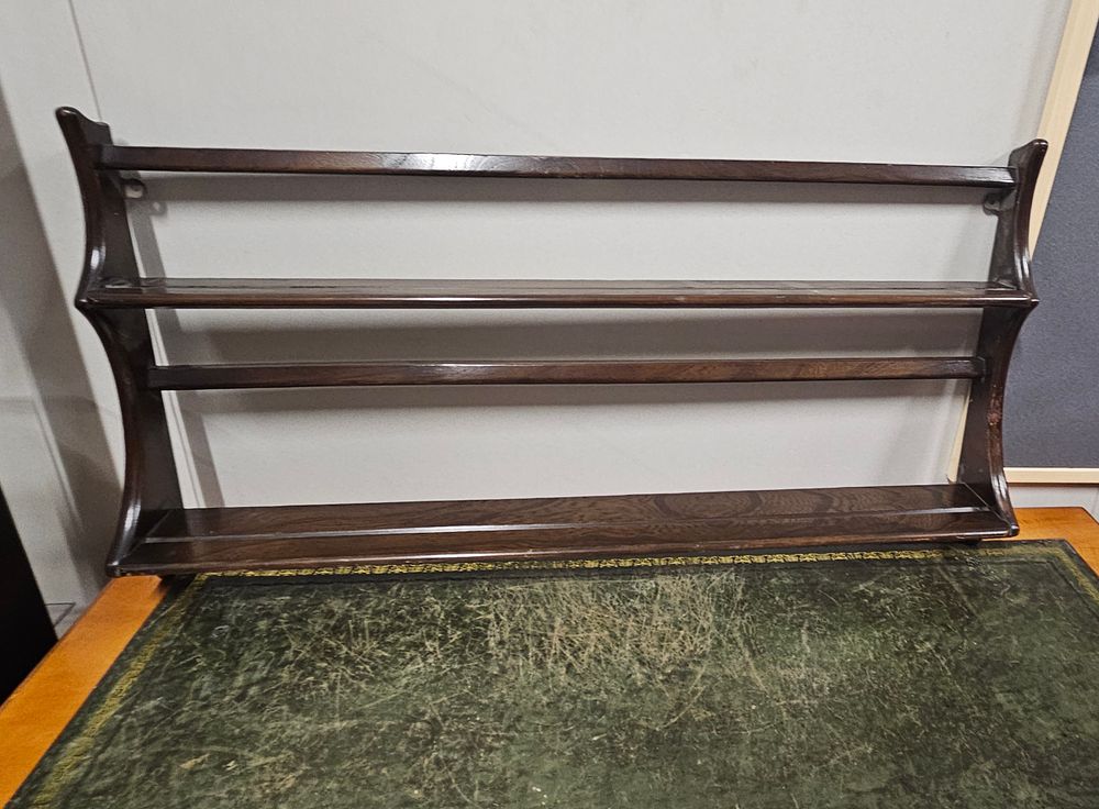 Lot 234: Ercol Dark wood plate rack