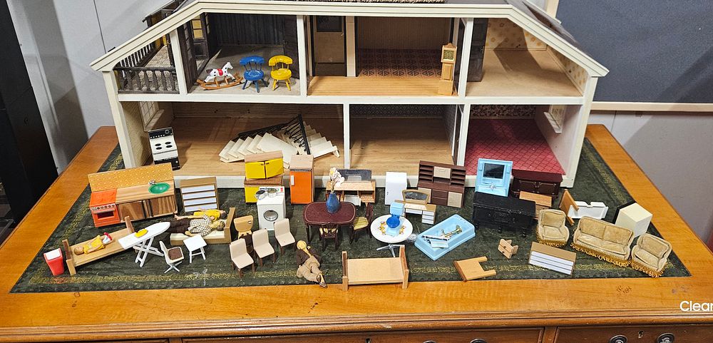 Lot 210: Large wooden dolls house with Furniture