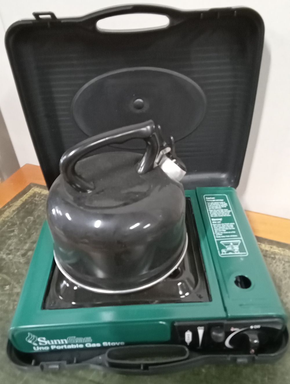 Lot 218: Portable gas stove and kettle