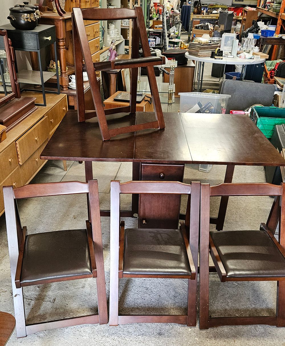 Lot 146: Space Saving Dining Table And 4 Folding Chairs.