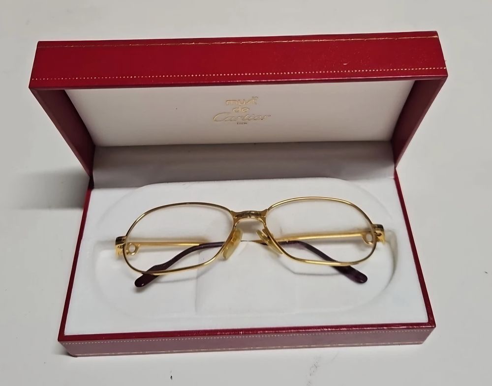 Lot 106: Boxed Cartier Glasses.