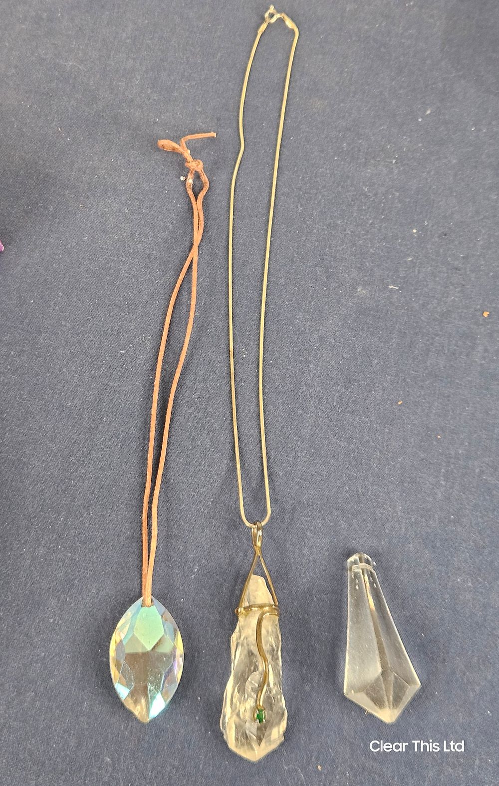 Lot 108: Healing Crystal Pendant and 2 others.