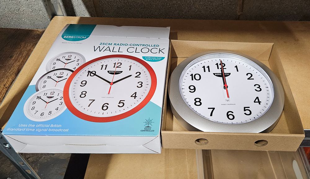 Lot 249: Bergstrom 25cm Radio Controlled Clock