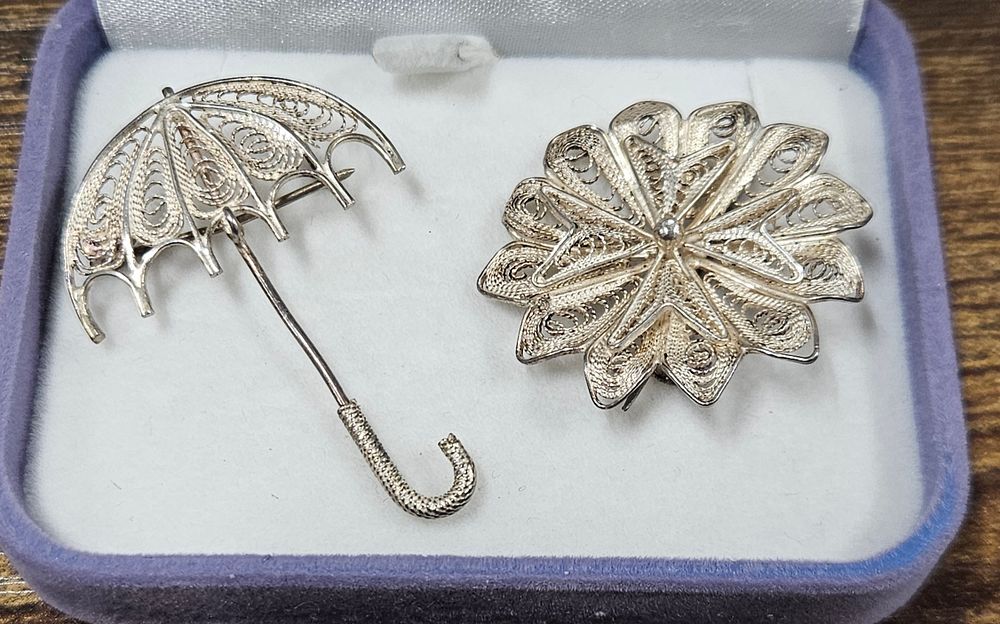 Lot 241: Two Sterling Silver Brooches.