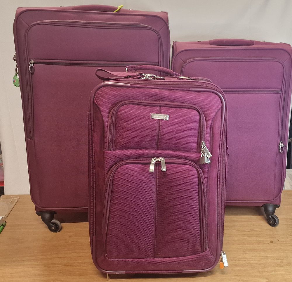 Lot 215: Three Grape Colour Modern Suitcases