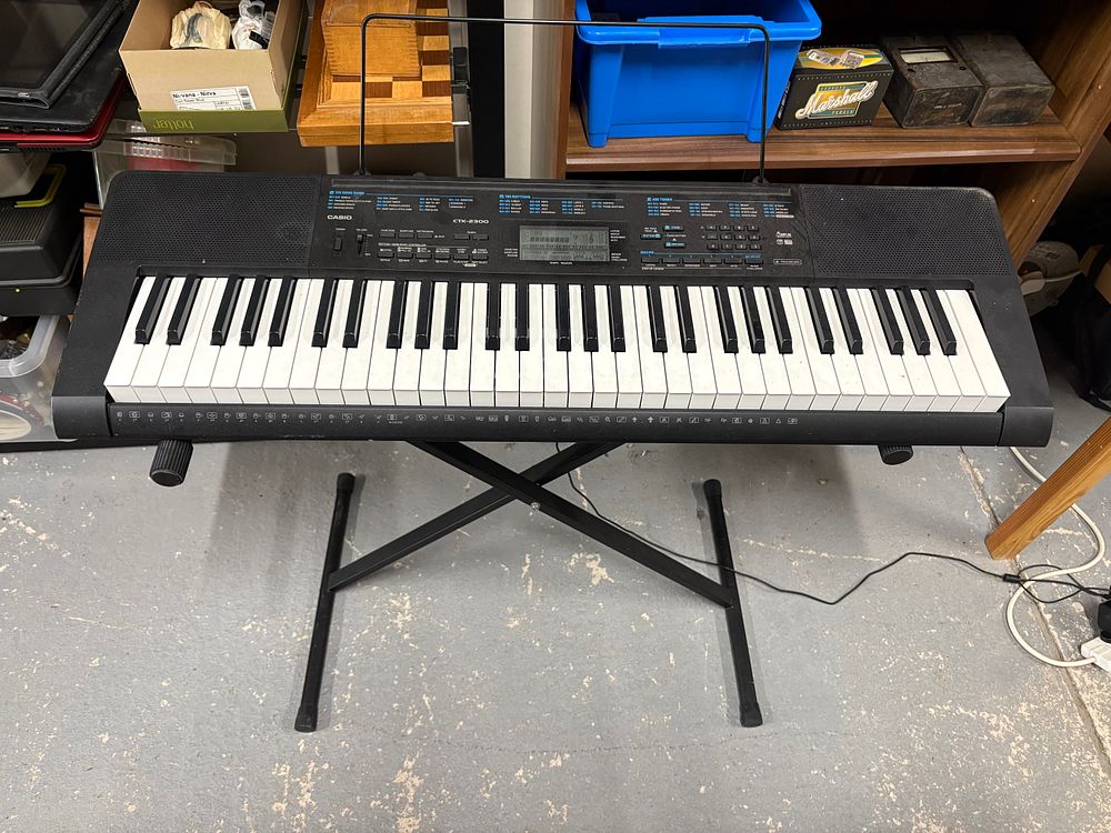 Lot 154: Casio Keyboard With Stand.