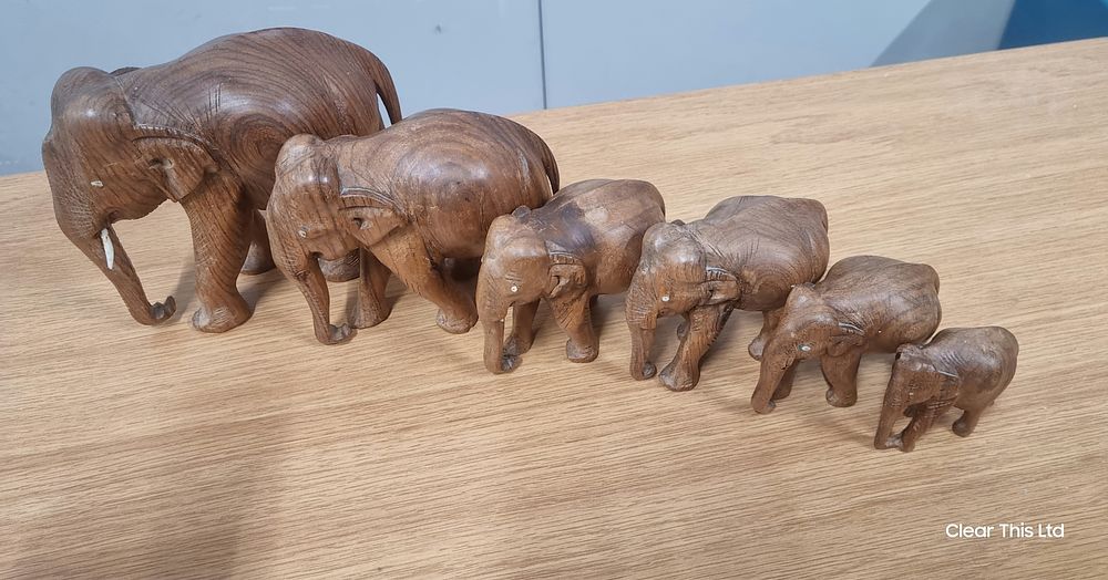 Lot 111: Six wooden elephants