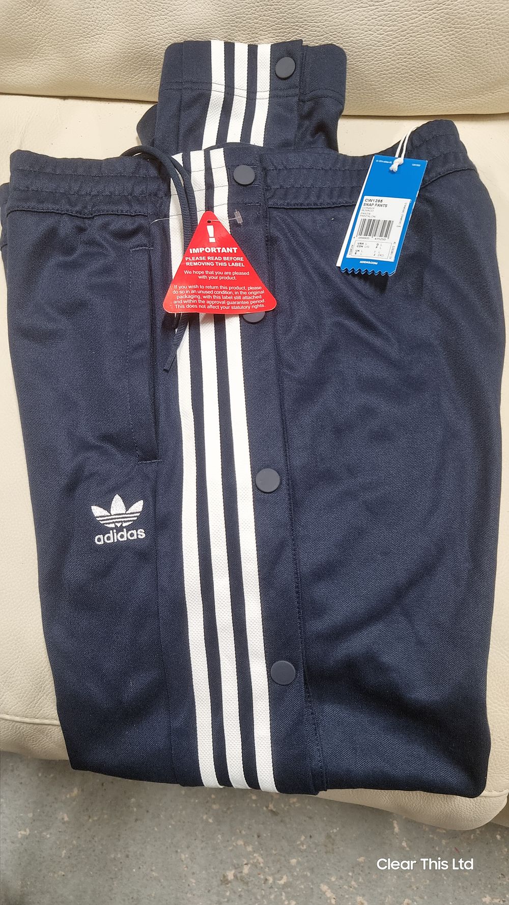 Lot 192: Authentic Adidas snap pants with tags