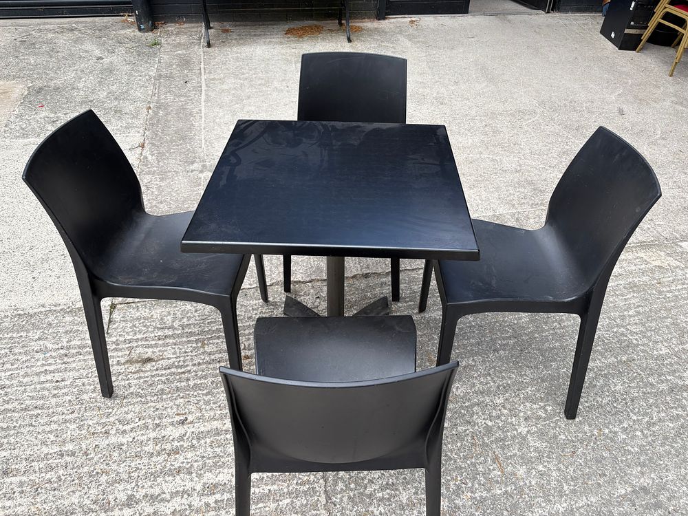 Lot 212: Indoor / Outdoor Table and 4 Black Chairs