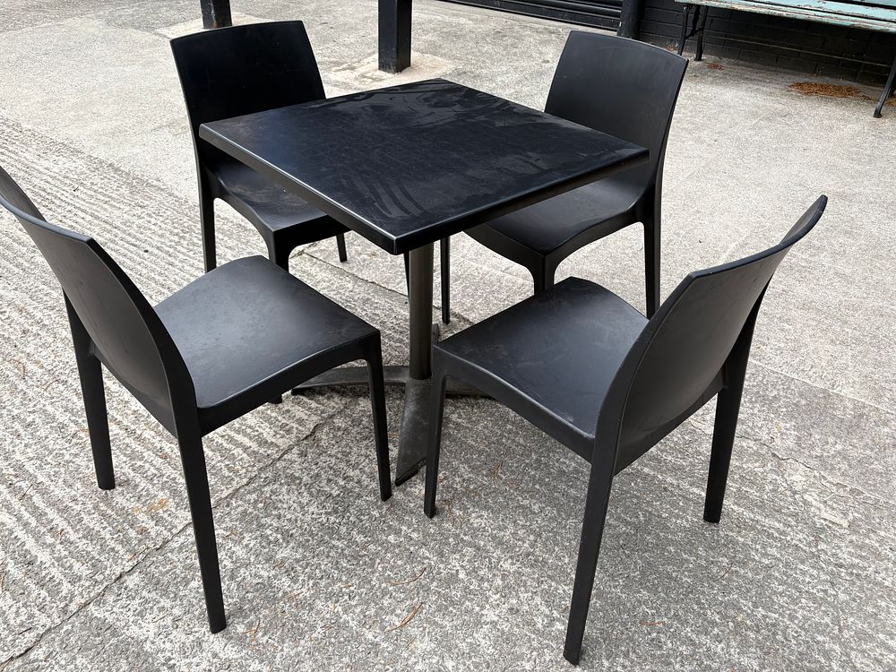 Lot 213: Indoor / Outdoor Table and 4 Black Chairs