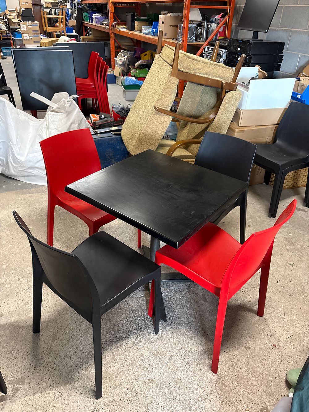 Lot 214: Indoor / Outdoor Table and 2 Red and 2 Black Chairs