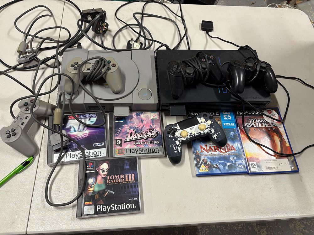 Lot 152: Sony PS 1 and PS 2 with Controllers and Games