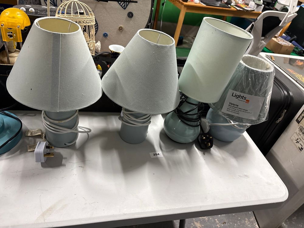 Lot 254: Four small lamps