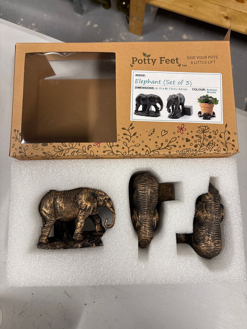 Lot 163: New Boxed Elephant plant Pot Lifters by Potty Feet