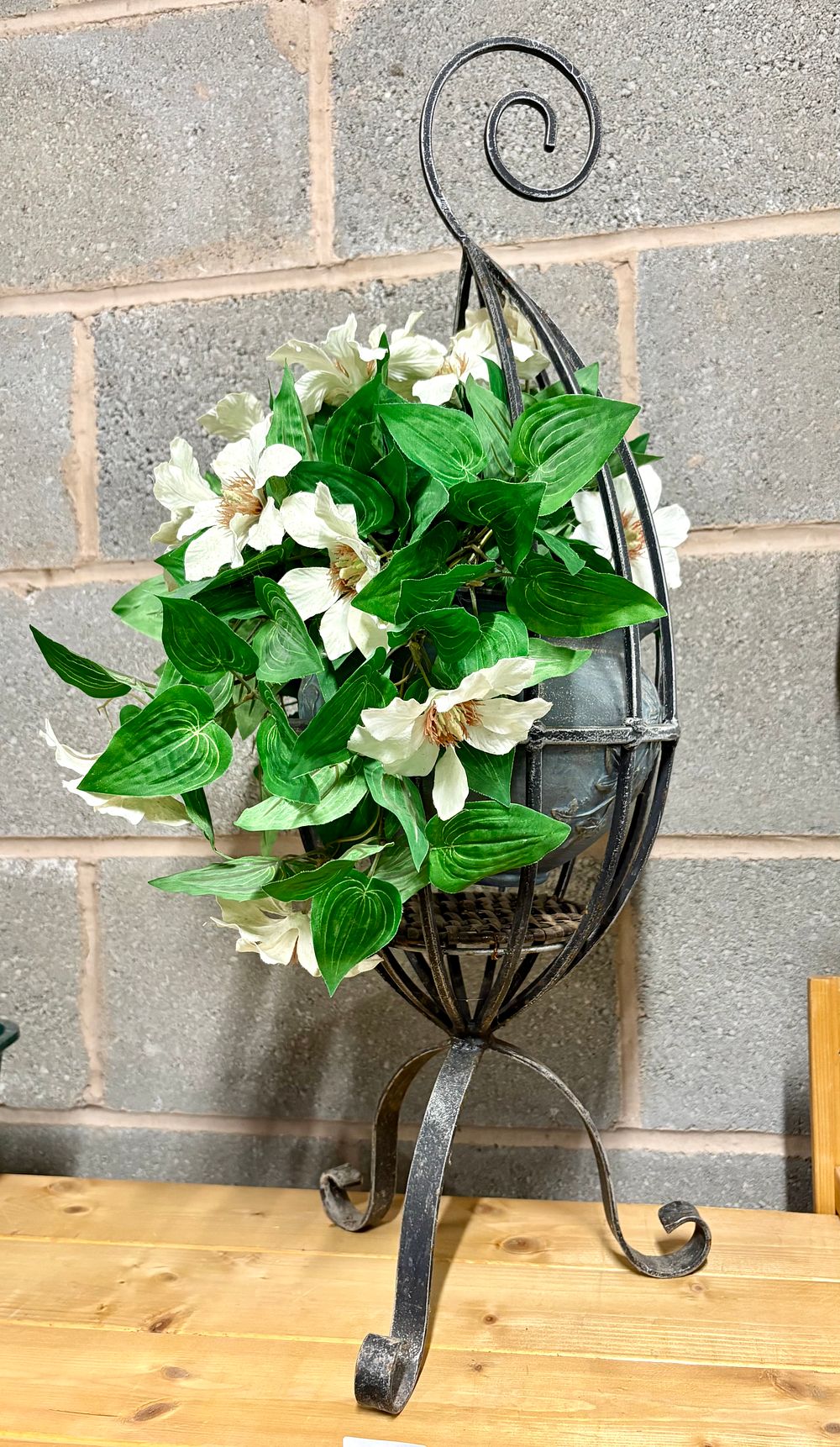 Lot 206: Artificial plant in pot with a metal stand