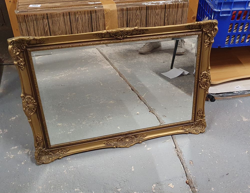 Lot 214: Gilt framed bevelled mirror
